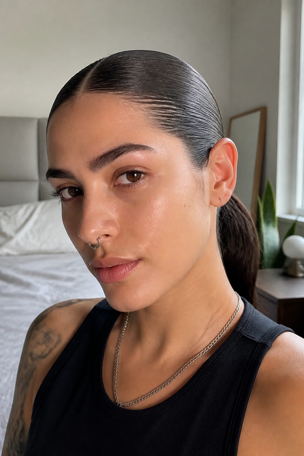 Close-up of a real person with a slicked-back low ponytail