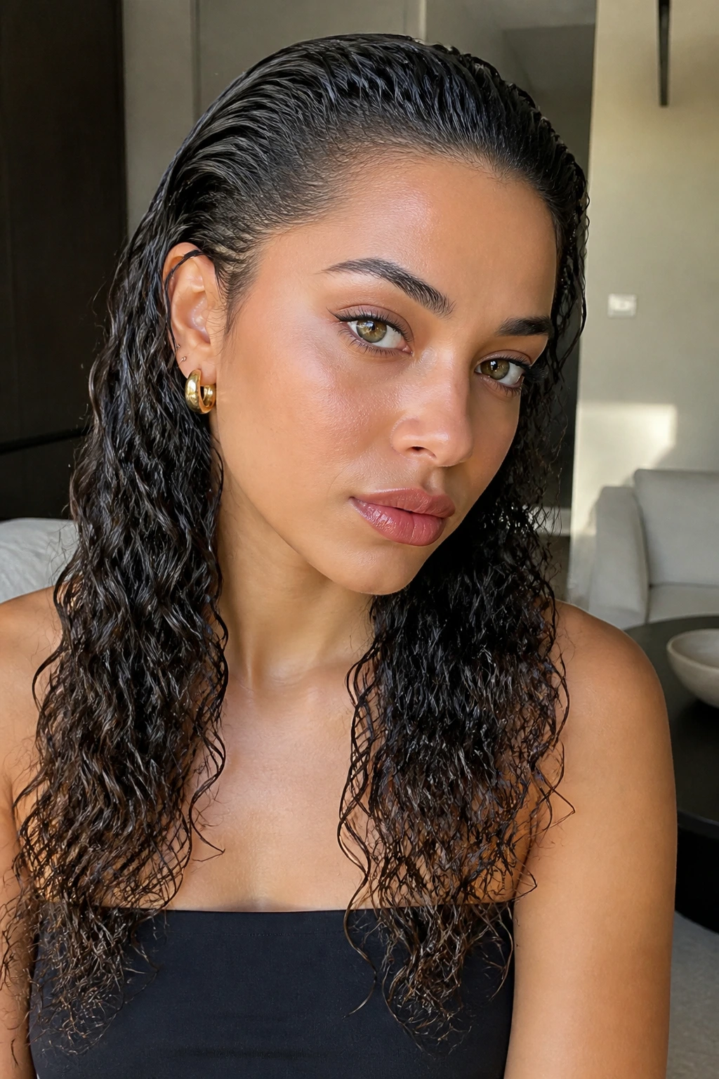 Real woman with a glossy slicked-back wet look and defined ends