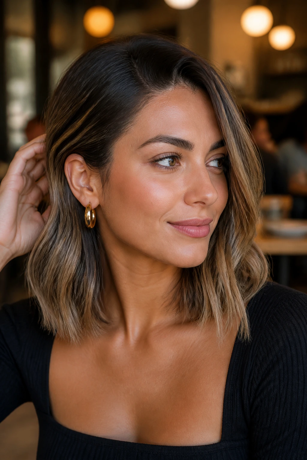 Portrait of woman with smoky beige collarbone cut and mid-length highlights