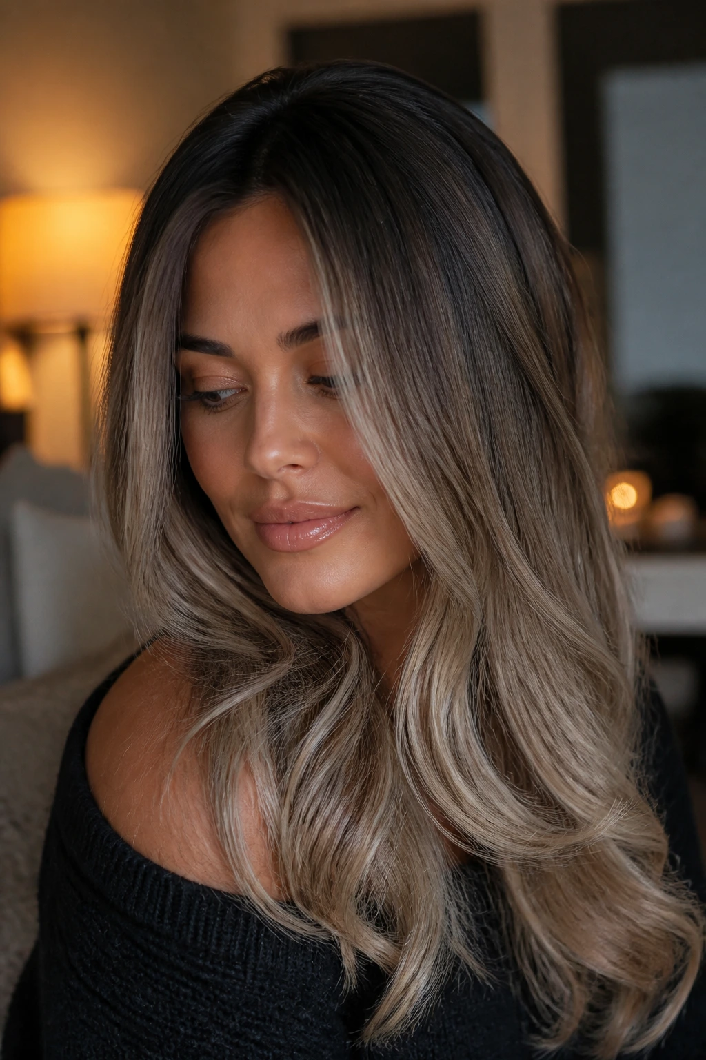 Portrait of a woman with smoky beige melt hair indoors with warm lighting