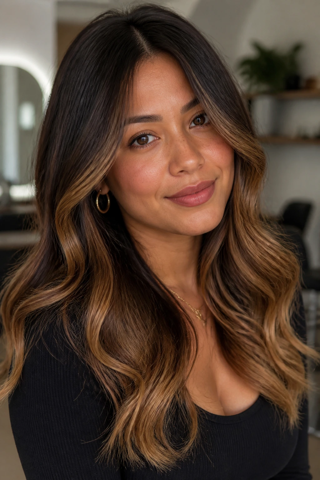 Close-up of a real person with smoky chocolate and gold ends in hair