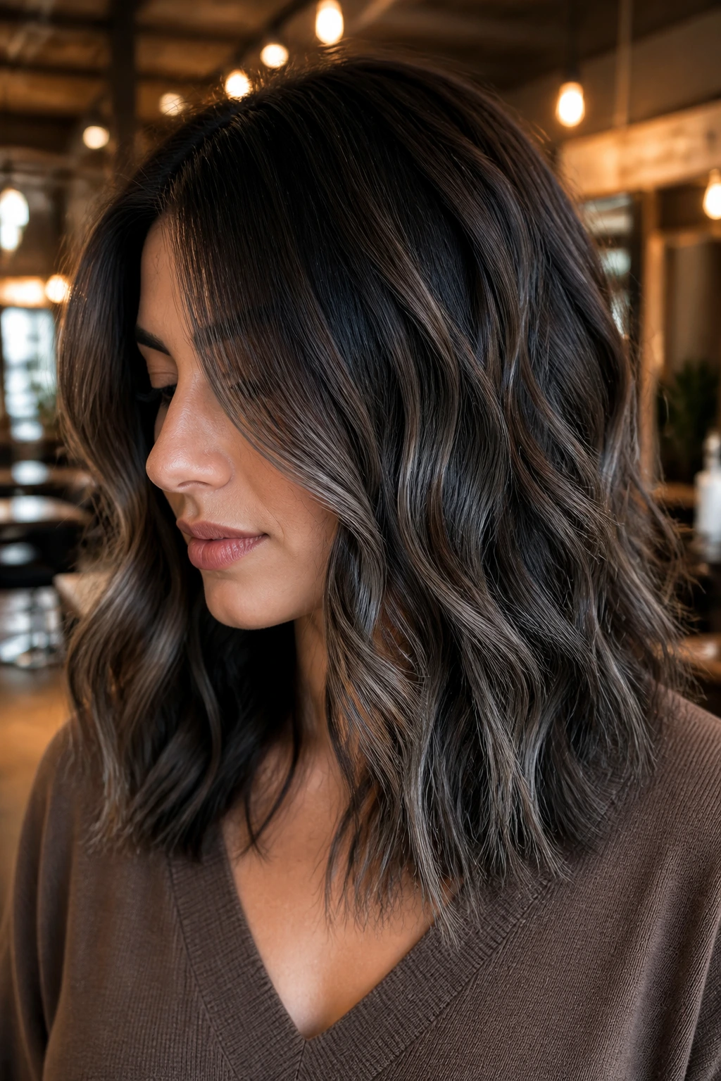 Close-up portrait of a real woman with shoulder-length hair in a smoky espresso melt