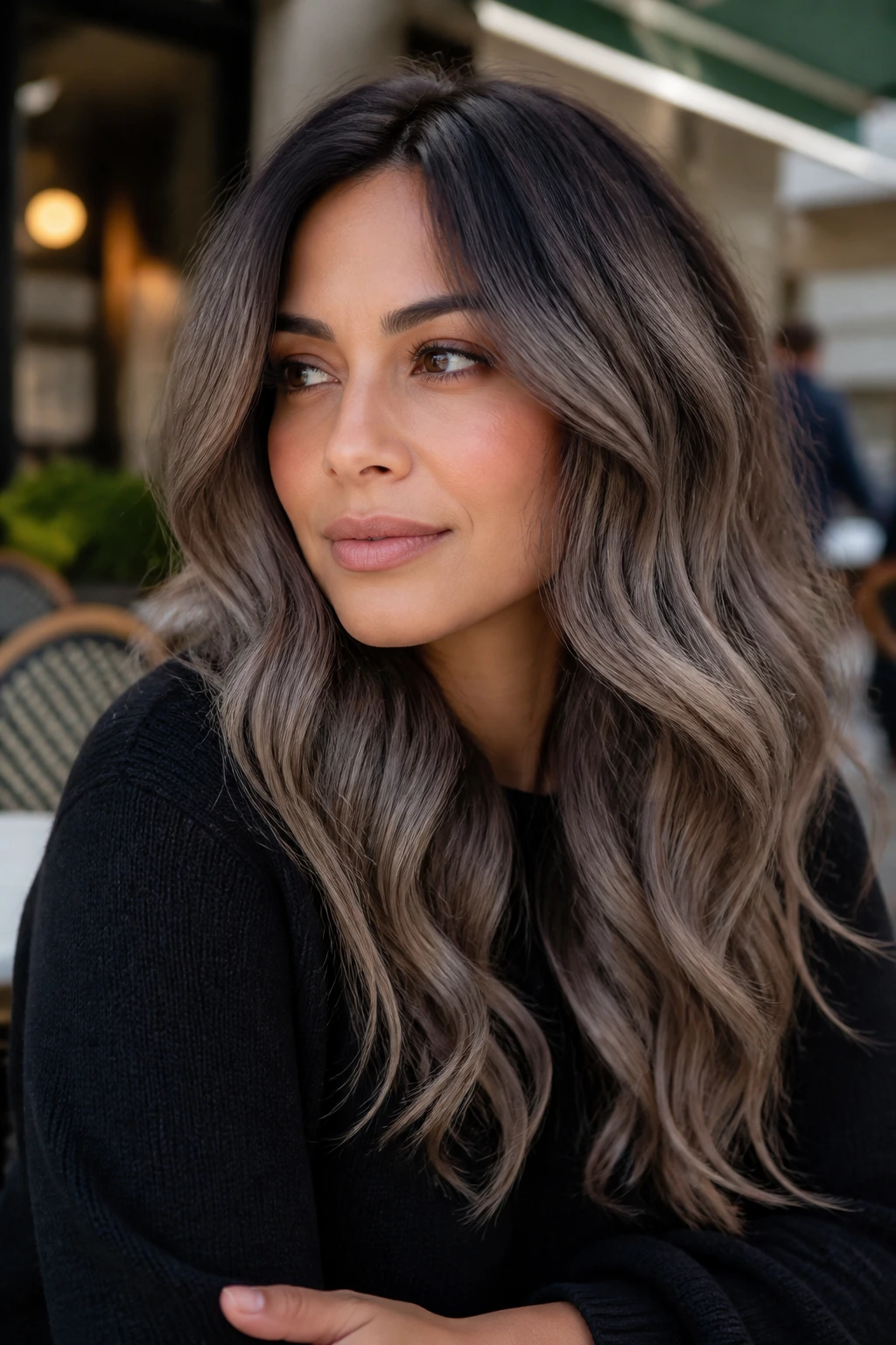 Real-woman portrait with smoky mocha balayage in outdoor street setting