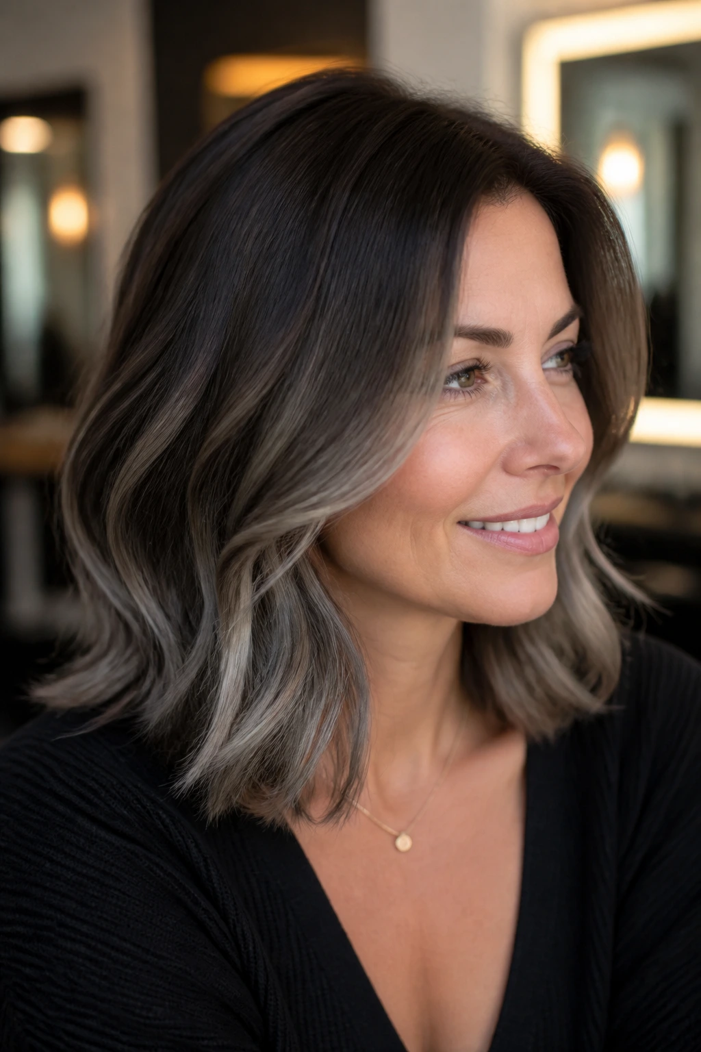 Close-up of smoky root melt transitioning from espresso to mushroom tones on real hair