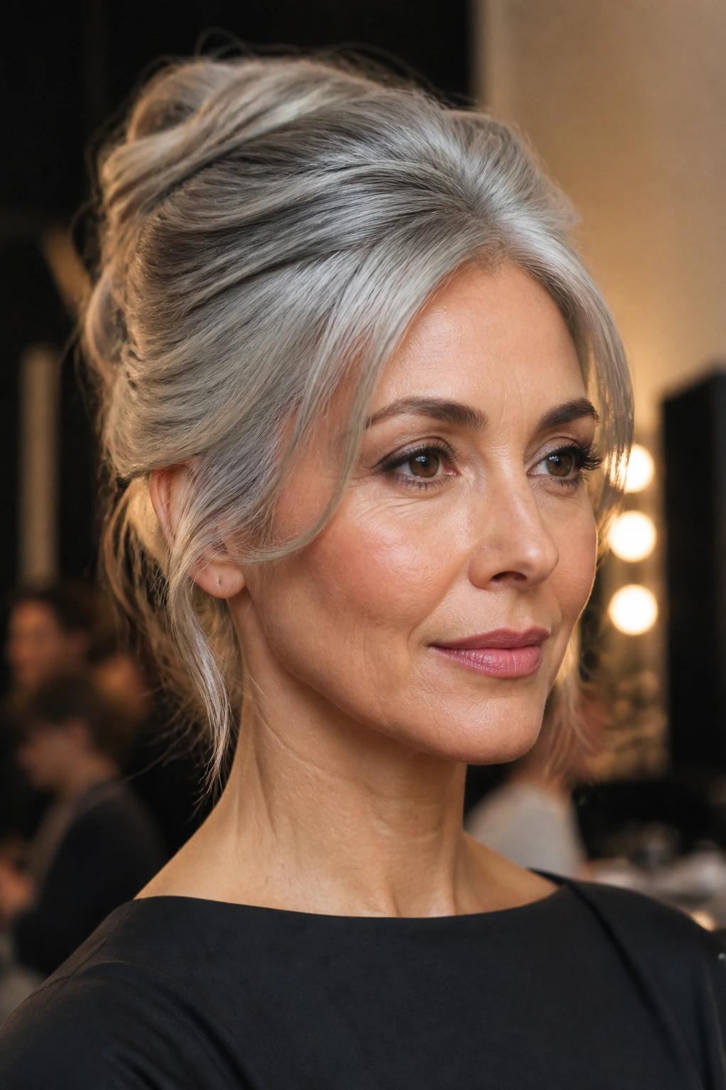 Close-up of a real woman with a smoky silver French twist.