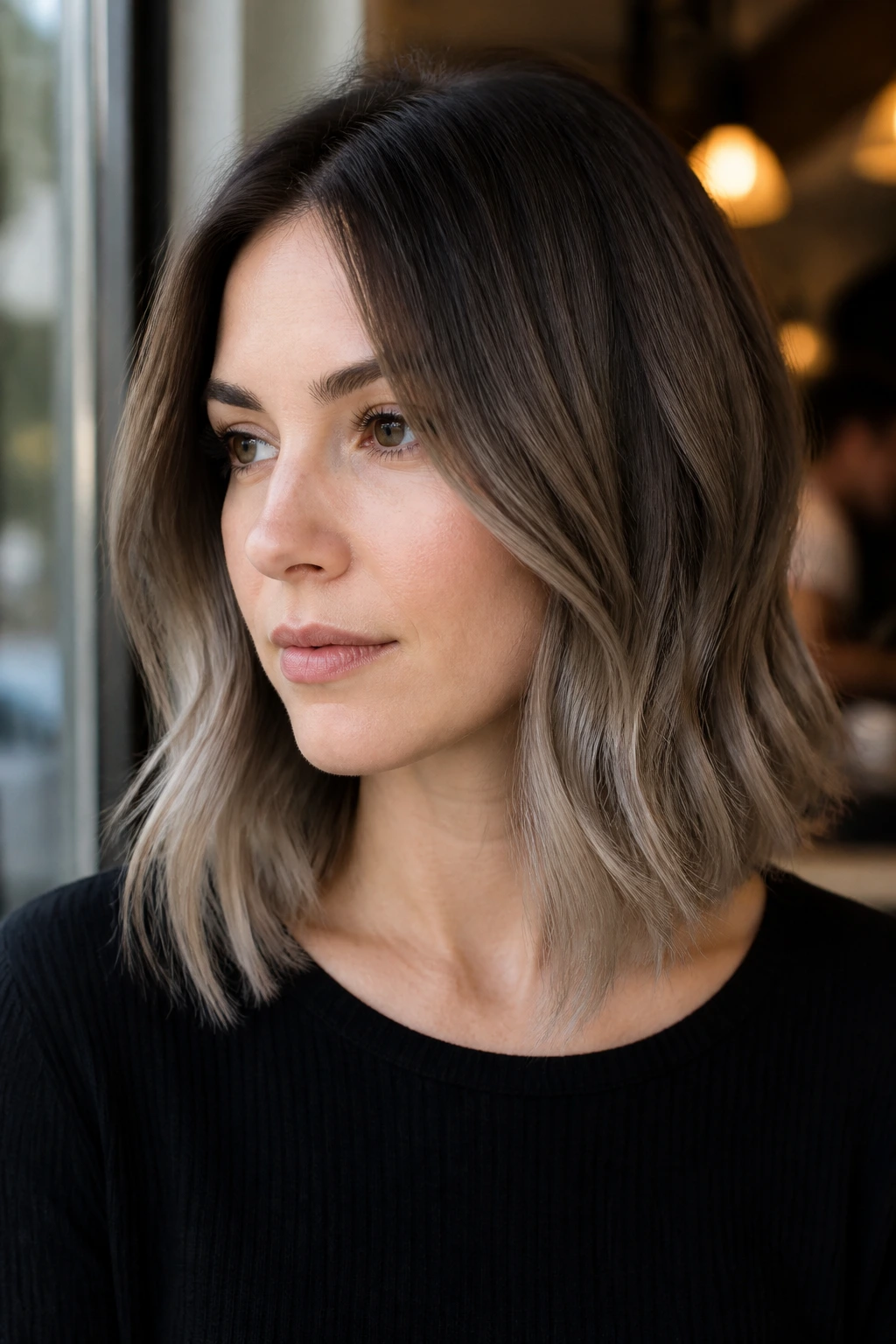 Portrait of a woman with smoky taupe ombre hair