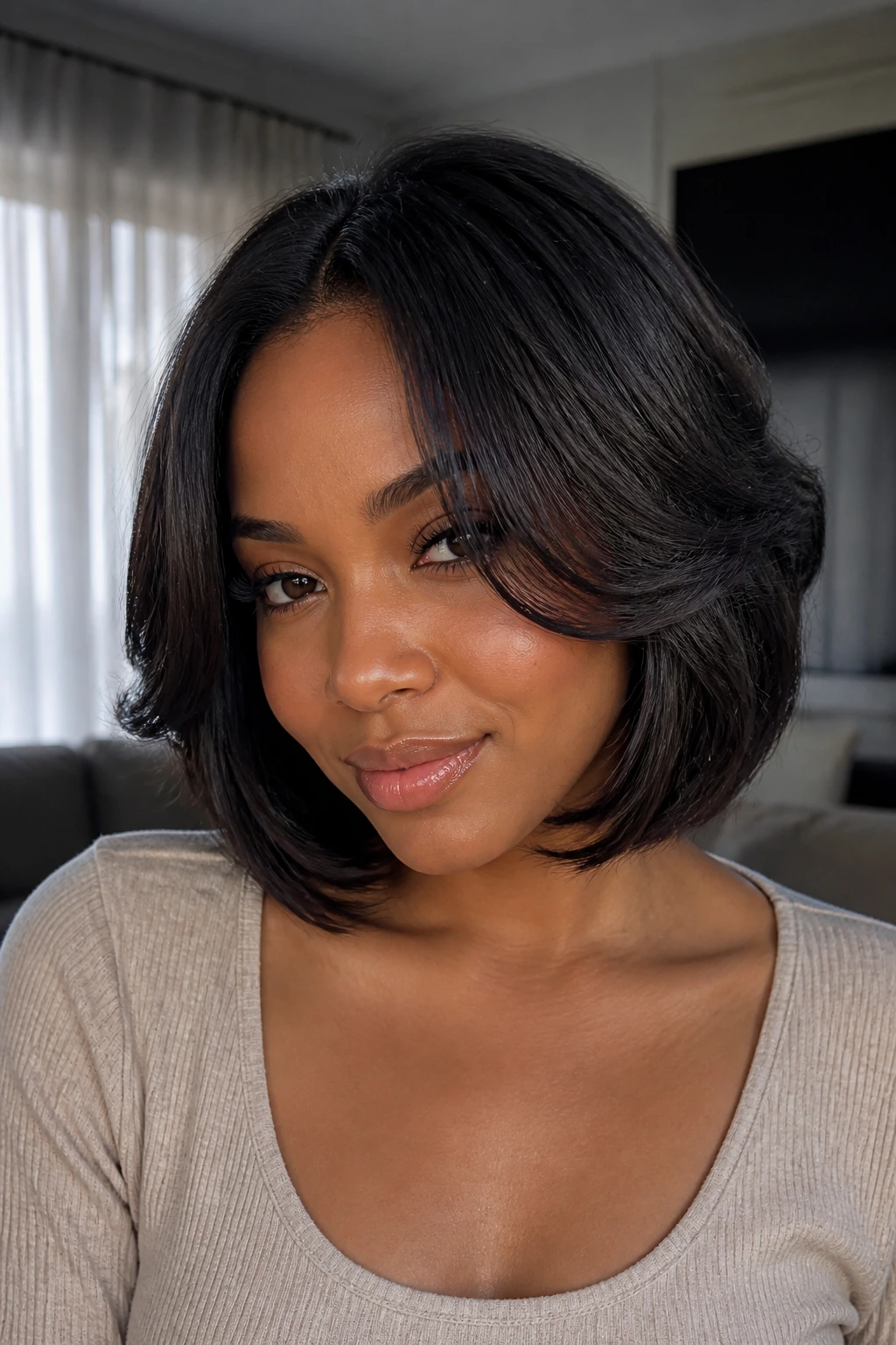 Close-up portrait of a real woman with Soft Bob and Face-Framing Layers highlighting front warmth