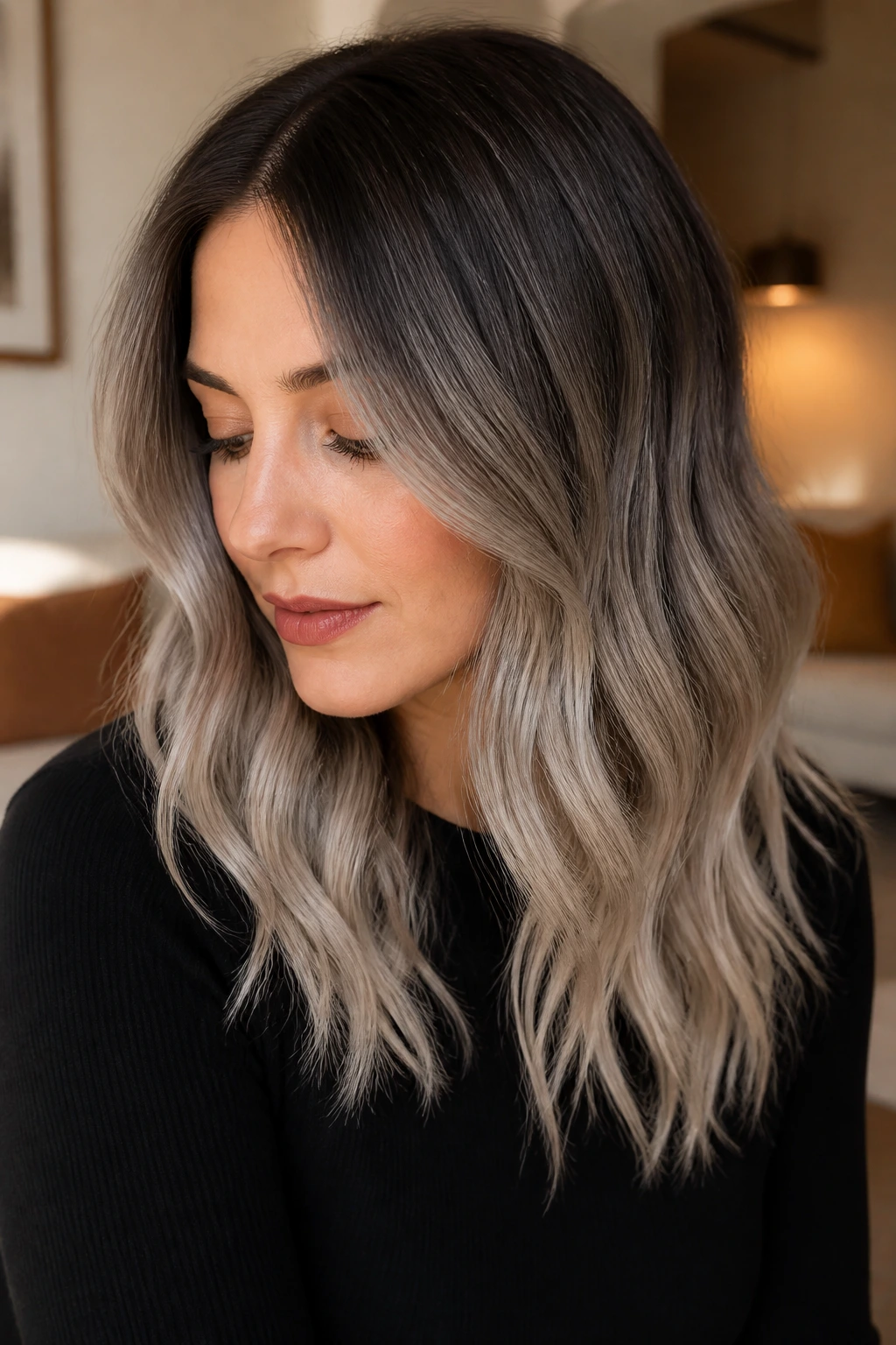 Close-up of a real woman with soft silver sombre fade in warm light.