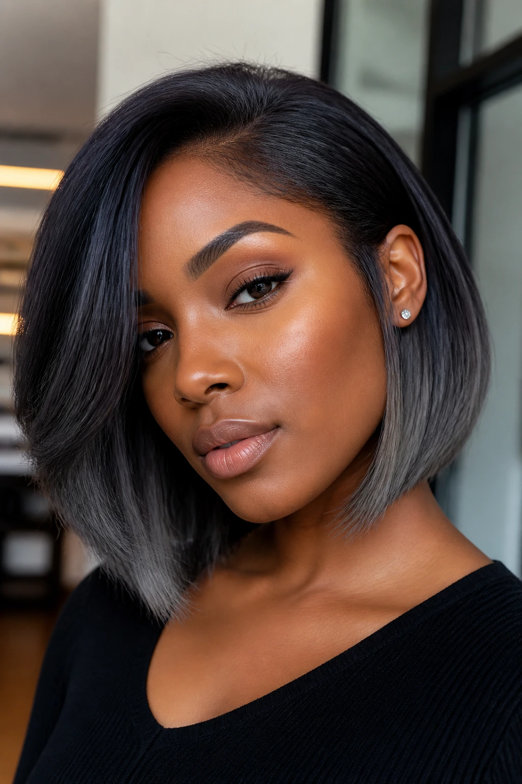 Portrait of a woman with soft smoke gray-black bob emphasizing diffused smoky tones