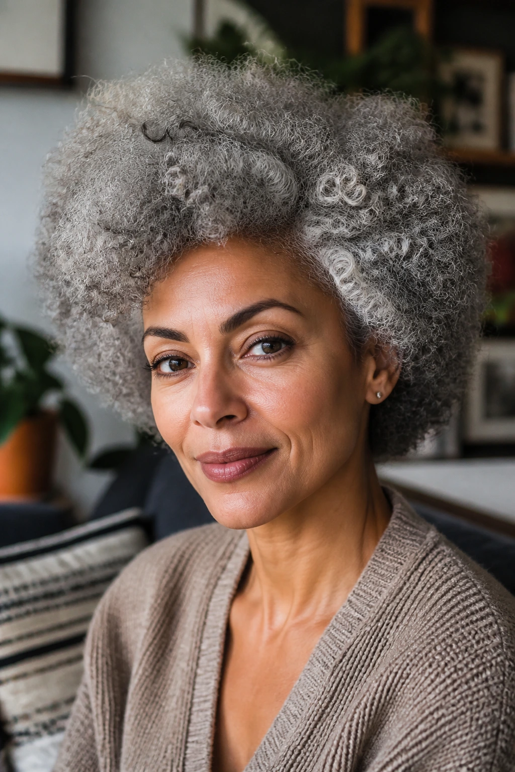 Close-up portrait of a real person with gray afro in soft daylight
