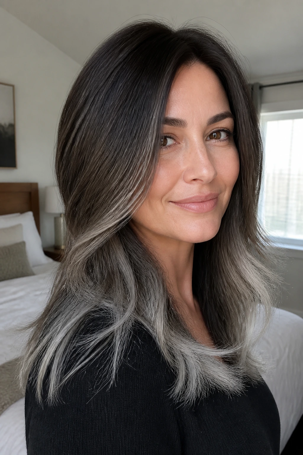Real woman with steel-tipped layers showing crisp edge and grey ends.