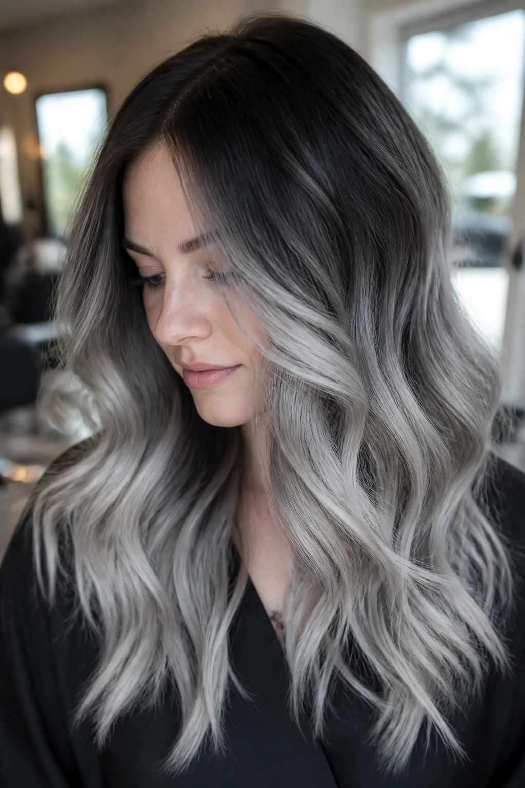 Close-up portrait with storm cloud balayage and loose waves
