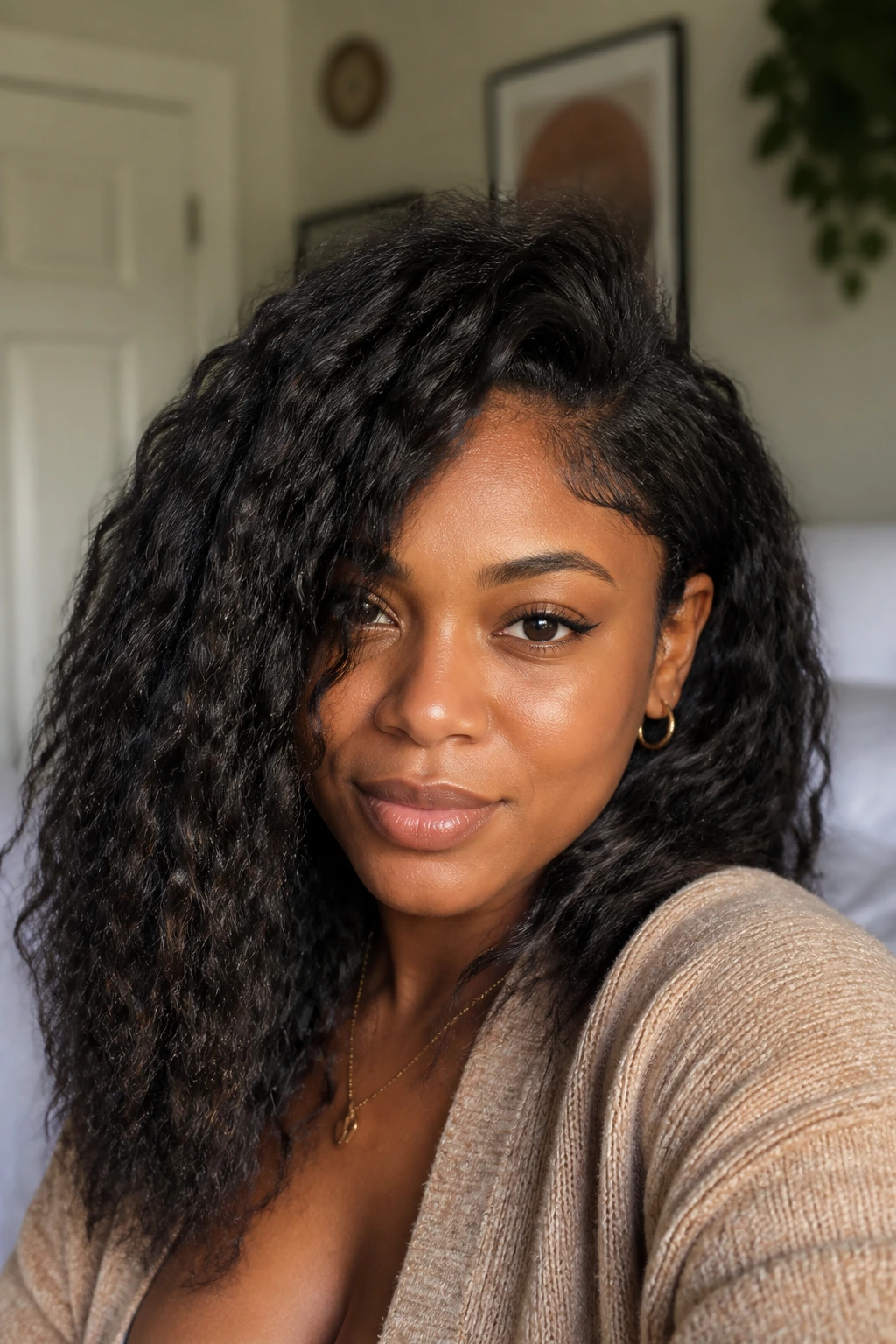 Portrait of a real woman showcasing a braid-out texture with soft waves.
