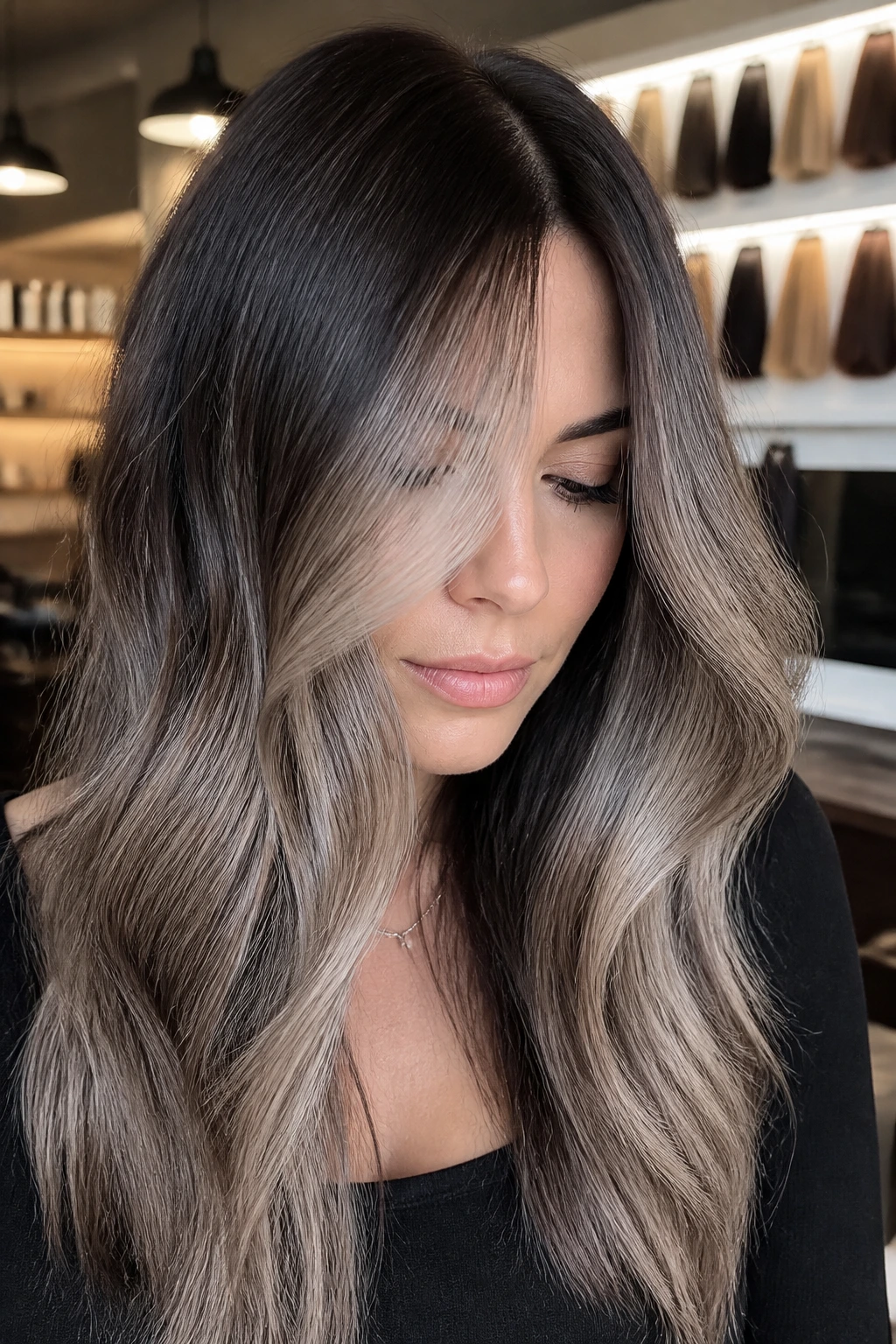 Close-up of dark hair with ash tones and toner, in a salon setting