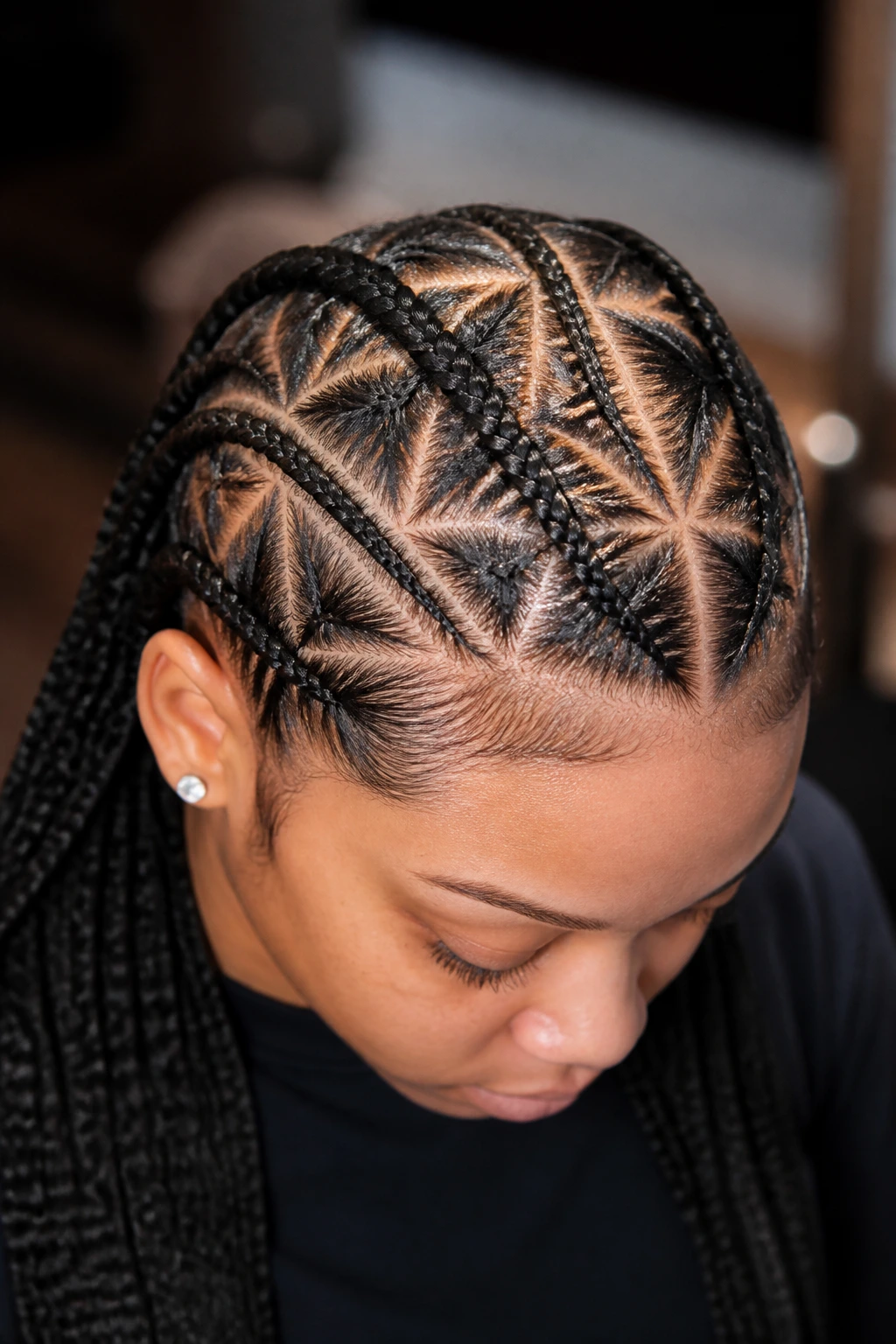 Triangle-part cornrows on a real person showing geometric scalp pattern