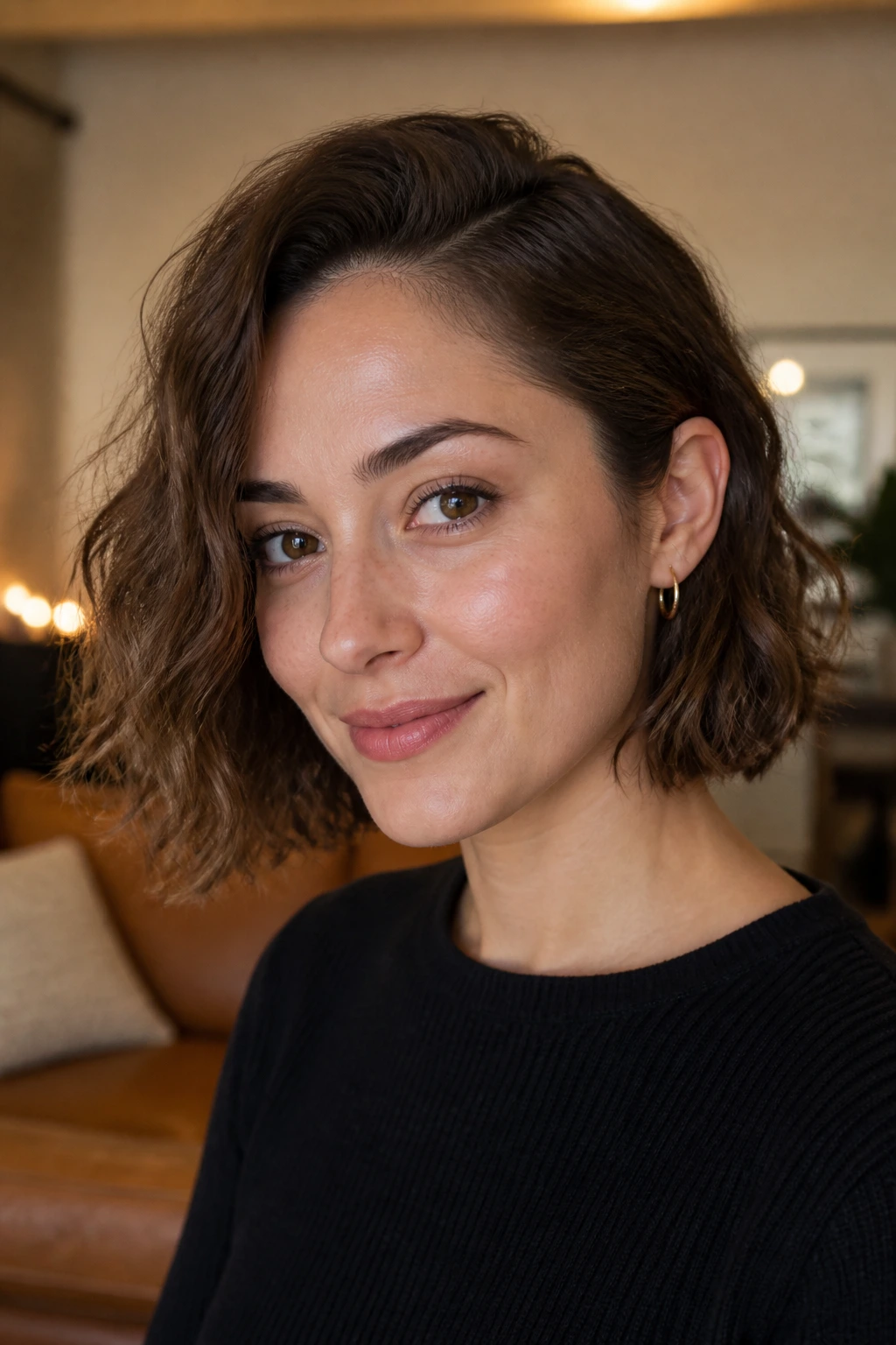 Real woman with tucked-behind-ear bob showing asymmetrical tuck at the jawline.