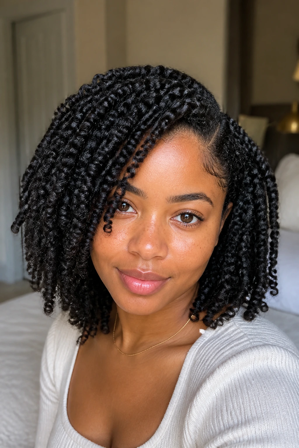Close-up of a real person with a side-parted twist-out
