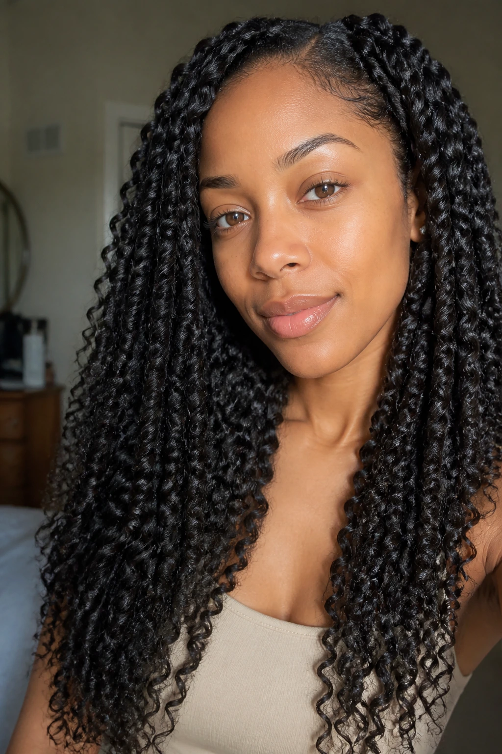 Close-up of a real woman with twist-out defined long curls in natural light