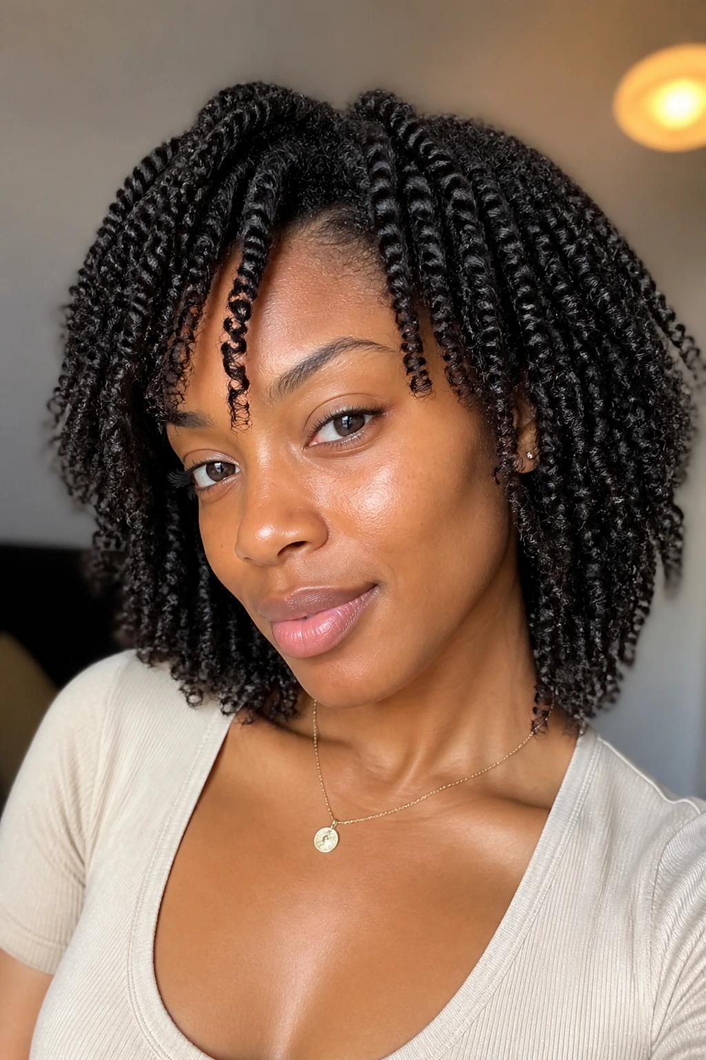 Portrait of a Black woman with two-strand twist-out hairstyle