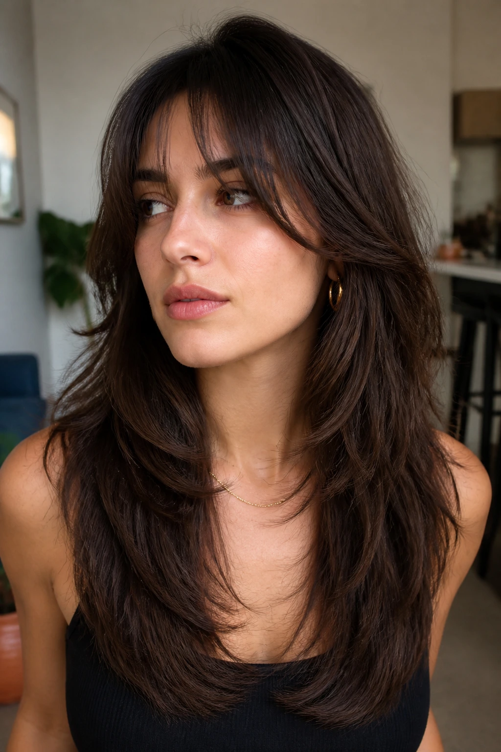 Real person with U-shaped long shag, interior layers creating a subtle U, wearing hair down.