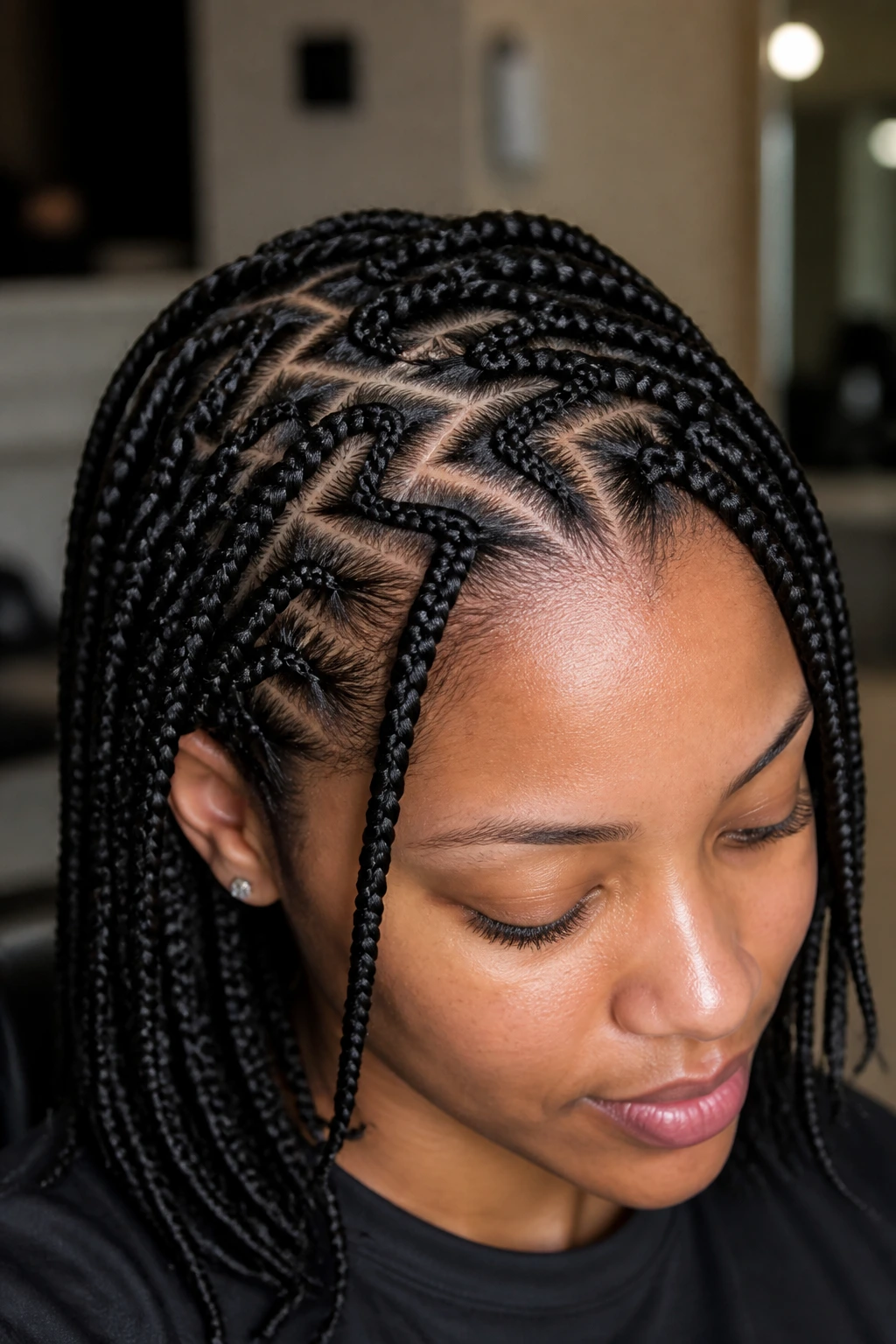 Close-up of real woman with zigzag-part box braids and crisp scalp lines