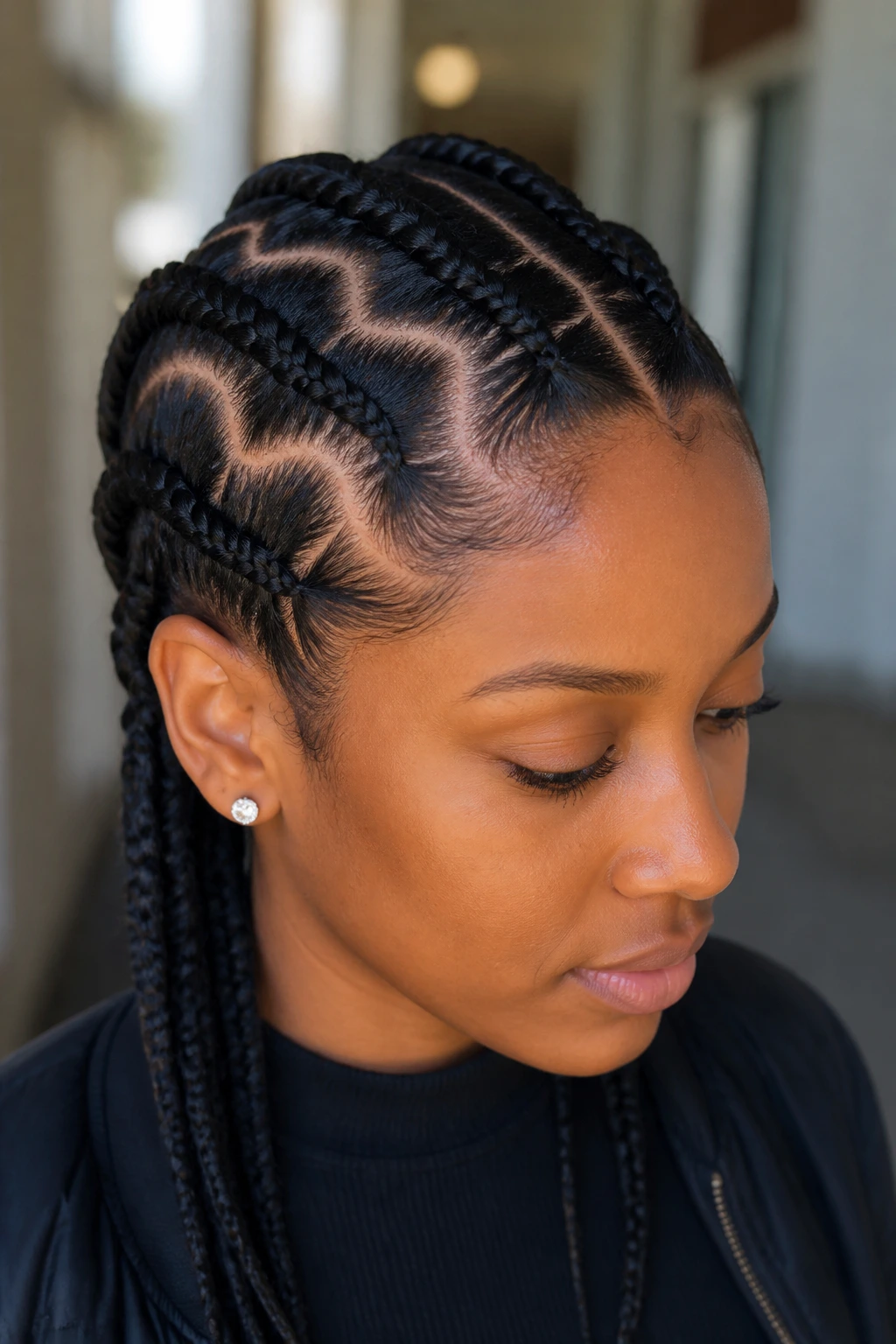 Close-up of a real woman with zigzag part braids and visible scalp pattern